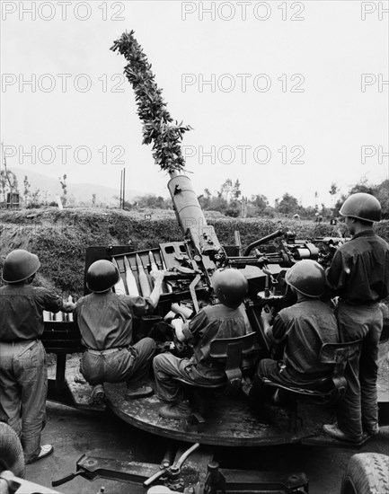 Ant-aircraft gunners of the vietnamese people's army at a firing point in the ngean province, north vietnam, 1969, s-60 57mm anti-aircraft gun; 70 rounds per minute.