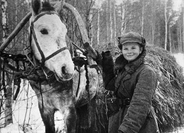 World war 2, 11 year old partisan, vanya shkelev, delivering hay to the guerillas, january 1943, he survived the war and became a navigator.