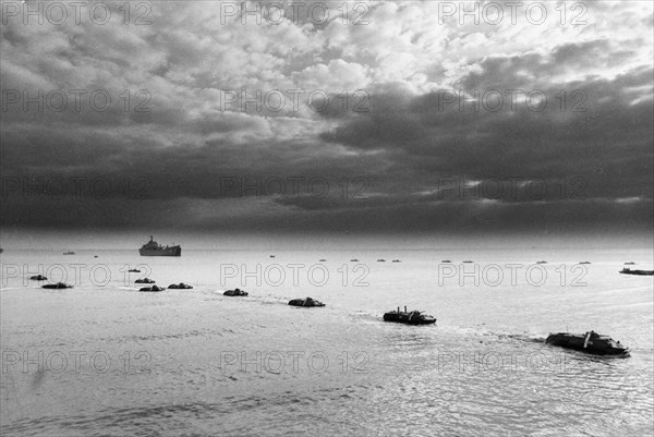 Soviet military exercises, amphibious apcs disembarking from aboard landing ships, october 1988.