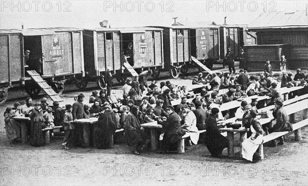 Trans-siberian railway under construction, early 20th century (1900?), settlers arrive at a station on trans-siberian railway.