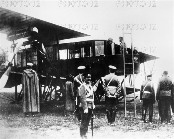 Nicholas ll and igor sikorsky, aircraft designer, are seen in cabin of igor sikorsky's the grand, 1913.