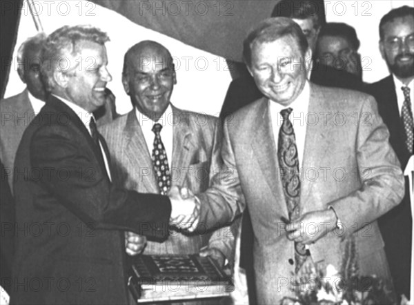 Ukrainian president leonid kuchma (right) and chairman of the ukrainian supreme soviet alexander moroz shake hands during the signing ceremony of the new ukrainian constitution held in marllnsky palace on july 12, 1996, kiev, ukraine.