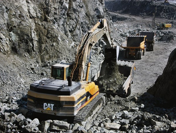 Chromite deposits of yamalo-nenets autonomous district, loading chromite ore onto  belaz dump trucks, november 2005.