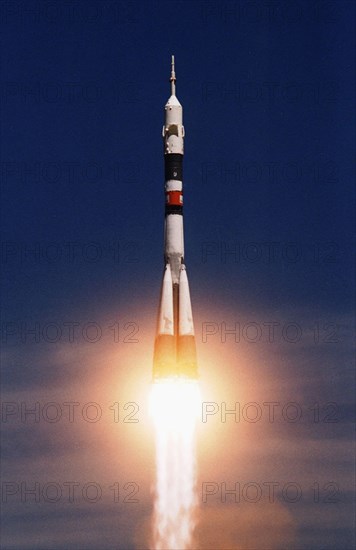 Baikonur launch pad, kazakhstan , april 28, 2001, a soyuz rocket with world's first space tourist, dennis tito, seen being successfully blasted off from baikonur space port, a soyuz tm space vehicle will take talgat musabayev, yuri baturin and the u,s, multi-millionaire to the international space station, the docking with the iss has been scheduled for monday.