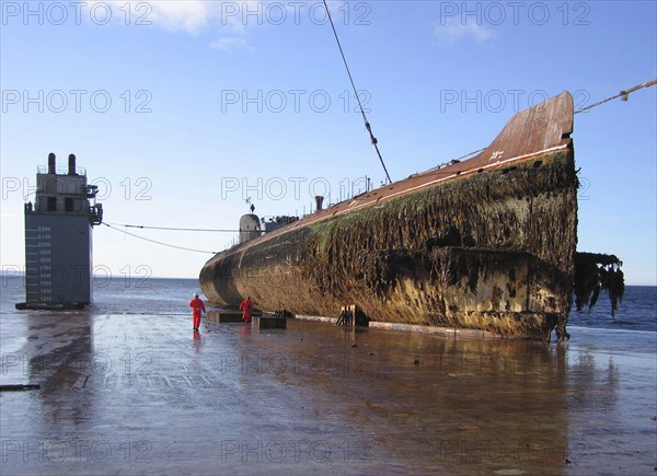 Murmansk region, russia, september 08, 2006, the decommissioned nuclear-powered submarine k-60 with a reactor aboard is transported on the dockwise (dutch heavy lift shipping company) semi-submersible vessel transshelf from the gremikha naval base to polyarny town for dismantling, the project is sponsored by norway and canada.