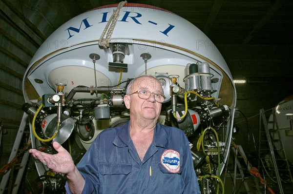 Murmansk, russia, july 23, 2007, anatoly sagalevitch, head of the mir program, pictured against mir-1 submersible, which is going to be used by russian explorers on a mission to probe the polar seabed and carry out scientific research, seen in the murmansk harbor.