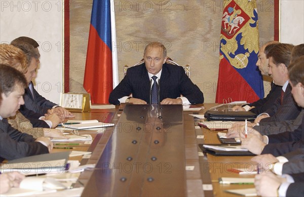 President vladimir putin (c)has said at the monday's meeting with the russian government that he will not meet representatives of the business community to discuss the situation with yukos, october 27, 2003.