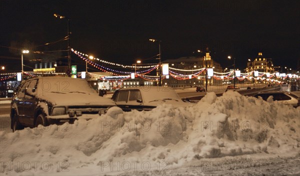 Moscow,russia, december 8, 2003,snow-ploughs clean moscow streets as the heavy snowfall that hit moscow made the road traffic difficult here.