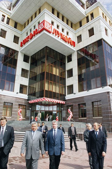 Tyumen, russia, june 17, 2004, tyumen governor sergei sobyanin (2nd l) and lukoil president vagit alekperov (2nd r) attend the opening ceremony of the new building of lukoil-west siberia in tyumen.