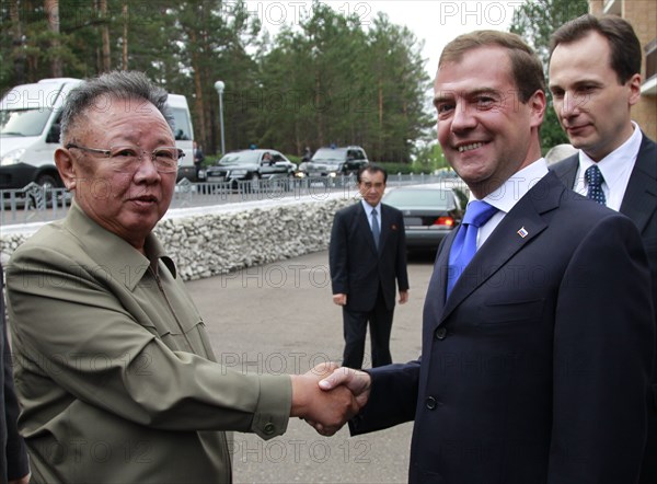 Ulan-ude, russia, august 24, 2011, russia's president dmitry medvedev (r) welcomes kim jong-il (kim jong il), the leader of the democratic people's republic of korea (north korea), the chairman of the national defense commission, general secretary of the workers' party of korea, in ulan-ude.