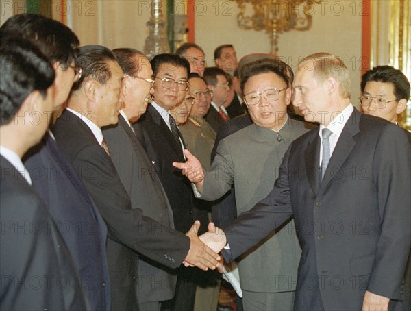 Moscow, russia, august 4, 2001, north korean leader kim jong-il, 2nd right, introduces the members of his delegation to president vladimir putin, right, prior to the talks in an extended format in the kremlin here on saturday.