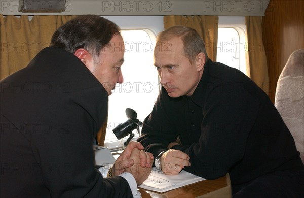 Russia, november 5, president vladimir putin (r) and adygeya head khazret sovmen talking on board a plane on tuesday, when the russian head of state inspected the reconstruction of housing in the flood-stricken districts of the stavropol and krasnodar territores and the adyghe republic.