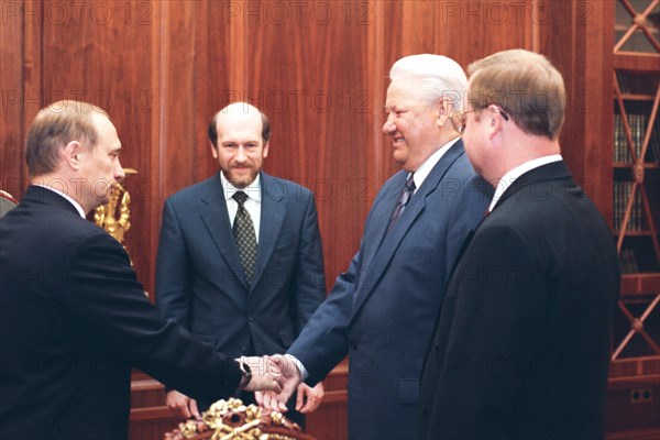 Moscow, russia, august 9, 1999, sergei stepashin (r), russian president boris yeltsin (second right), alexander voloshin (center) and vladimir putin, president boris yeltsin dismissed sergei stepashin's cabinet and appointed vlladimir putin prime minister.