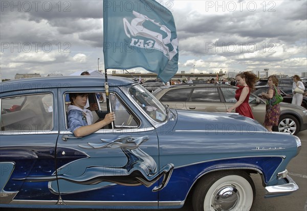 Pobeda car with gaz logo on the sides at custom car painting contest aerograf-2007 in moscow's khodynskoye pole, july 21, 2007.