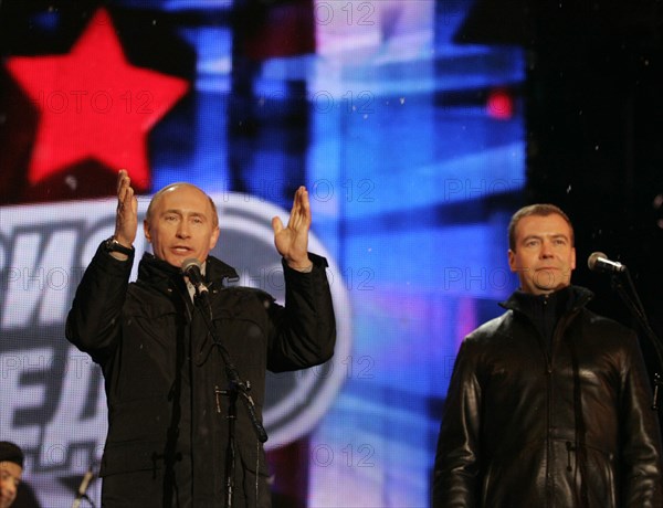 Moscow, russia, march 2, 2008, outgoing president vladimir putin (l) and first deputy prime minister dmitry medvedev address the audience during a concert in vasilyevsky spusk off red square, marking the outcome of the 2008 presidential election.