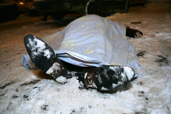 Moscow, russia, february 5, 2009, body of former deputy mayor of grozny gilani shepiyev, gunned down at the entrance to his home in western moscow, seen at the site of the murder.