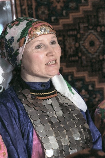 Udmurtia, siberia, russia, 2/93, a peasant resident of the udmurt village of zavyalova wearing udmart national costume.