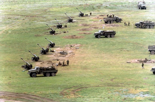 Chechnya, russia, 10/19/99, an artillery battery at a new fire position in chechnya's shelkovskaya district, on the eve of the second stage of the anti-terrorism operation in the northern caucasus, the united group of federal troops is now being actively regrouped, the vanguard units are entrenching on the right-hand bank of the terek river.