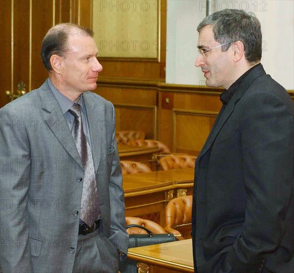 President of the interross holding company vladimir potanin (l) and chairman of the management board of yukos oil company mikhail khodorkovsky attending the meeting of the council on entrepreneurship under the russian government, held here on monday, under consideration by the government was the outlook for russia's socio-economic development for 2003 and the prospects for industry's development, moscow, russia, june 17, 2003.