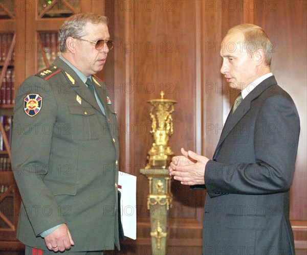 President vladimir putin (r) and director of the russian federal borderguard service konstantin totsky (l) during their meeting in the kremlin today,head of service reported president on the situation in the north caucasus and tajik-afghan areas of responsibility of the service and on the results of the dushanbe round of the council of heads of borderguard services of the cis member countries, june 20, 2002.