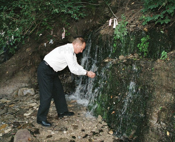 Russian president vladimir putin visitng an ancient fortress of izborsk near pskov, russia, in august 2002.