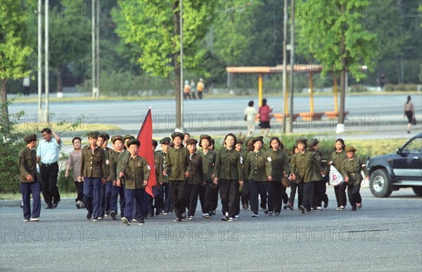 Korean people's democratic republic,, october 17 2002: young pioneers of north korea pictured marching along the streets of pyongyang,the capital of the kpdr under the red flag , (photo itar-tass/ boris kavashkin).