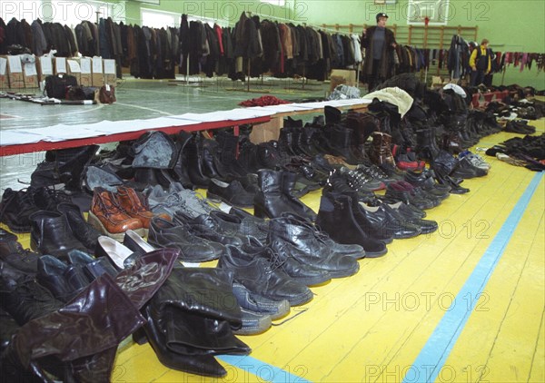 Moscow, russia, november 12 2002: former hostages retrieving their personal belongings at the sports hall of the dubrovka theatre centre on tuesday, the moscow prosecutor's office has started to return  belongings of people who were held hostage in the theatre building on october 23-26 2002.