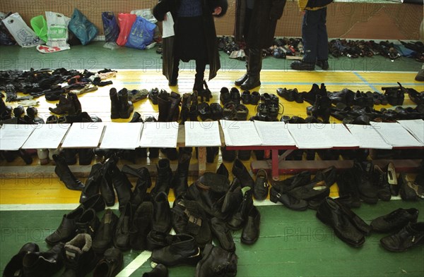 Moscow, russia, november 12 2002: former hostages retrieving their personal belongings at the sports hall of the dubrovka theatre centre on tuesday, the moscow prosecutor's office has started to return  belongings of people who were held hostage in the theatre building on october 23-26 2002.