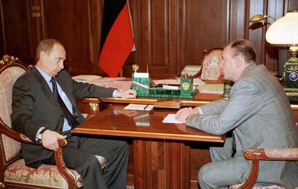 President vladimir putin (l) pictured talking with vladimir potanin, a prominent russian businessman who heads the interros holding company, on tuesday in the kremlin, december 24, 2002.