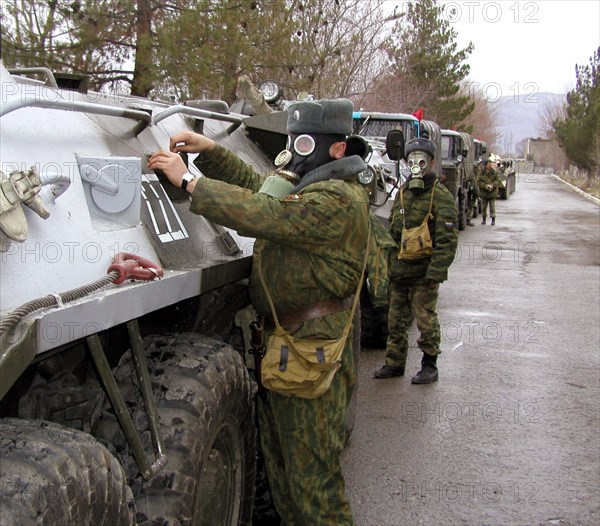 Tajikistan, february 18, 2002, servicemen pictured during the military exercises of the russian 201st division, held on the 'lyaur' training range in the south of tajikistan, units of a separate batallion of the collective fast reaction force of the cis took part in field firing, the troops drilled cooperation and tactics in case of penetration of large groups of terrorists to the republic's territory.