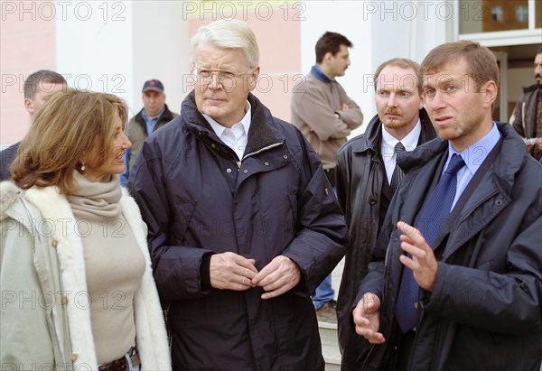 Governor of chukotka autonomous district roman abramovich (right), president of iceland ragnar grimsson (center) and president's wife dorrit musaeff (left) visiting newly-built houses in anadyr, august 22, 2003.