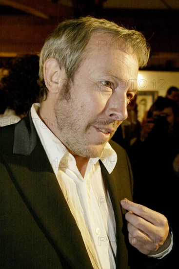 Popular russian singer songwriter andrei makarevich seen at the exhibition 'fifty women of andrei makarevich' which opened at alla bulyanskaya's picture gallery, moscow, russia, december 2003.