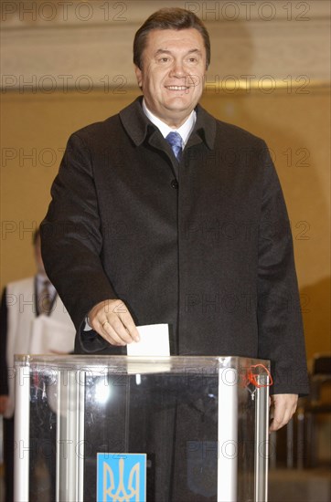 Ukraine election 2004, ukrainian prime minister and presidential hopeful viktor yanukovich casts his ballot at a polling station in kiev during the second round of presidential election on sunday, november 21 2004,                               .