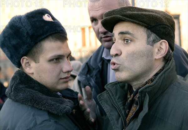 Garry kasparov (right), leader of the united civil front, is pictured at the “protest march of those who disagree” at the stone from solovki (a monument to the victims of gulag) in lubyanka square (where the kgb headquarters were located), moscow, russia, october 30 2005, the protest march was organized by garry kasparov’s united civil front.