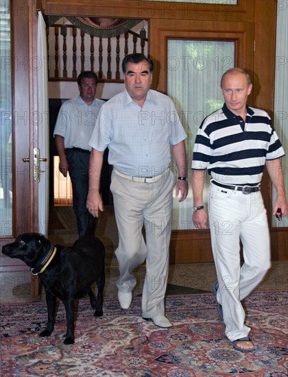 Russian president vladimir putin, tajikistan president emomali rakhmonov and russian presidential aide sergei prikhodko (r-l) seen during their meeting at the bocharov ruchei residence on black sea coast.