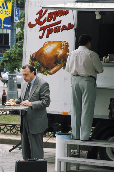 Truck selling grilled chicken - popular among those who can afford it - in moscow, june 1999.