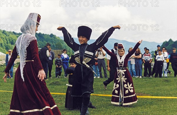 Young members of the almat folk dance ensemble performing during a demonstration of balkar highland culture, kabardino-balkaria, russia.