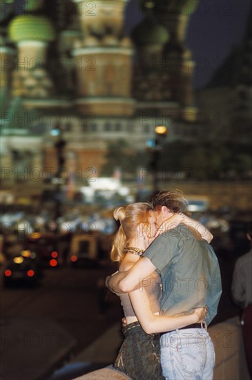 A young couple kissing in red square, moscow, 1997.