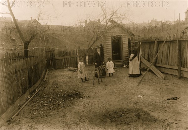 African American family standing in a yard in Georgia