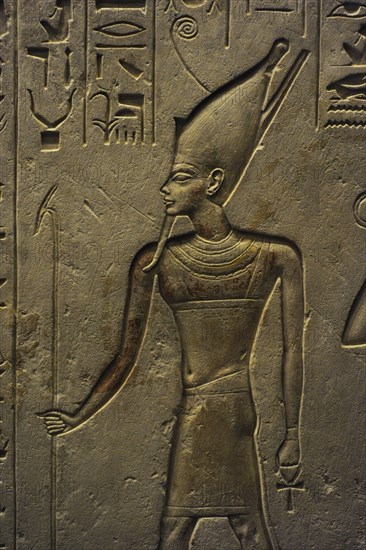 Stele of Haremheb adoring three gods.