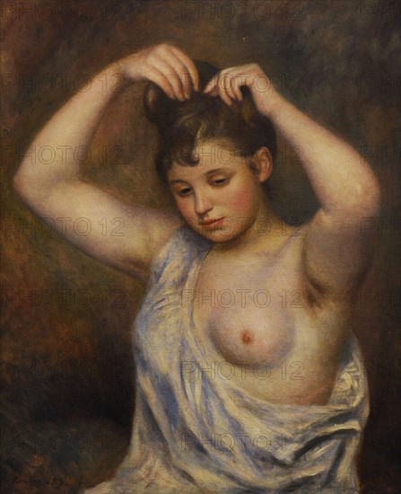 Woman arranging her hair.