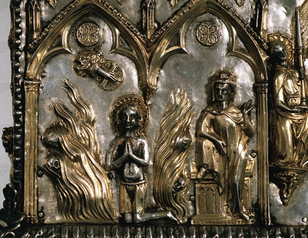 Reliquary casket of Saint Cucuphas. Wooden gilded silver. 14th Century. Detail. Saint Cucuphas in a bonfire from where demons are fleeing. Over the Saint, the Hand of God (dextera domini) while Maximian is watching from his throne. Ca. 1303. Spain.