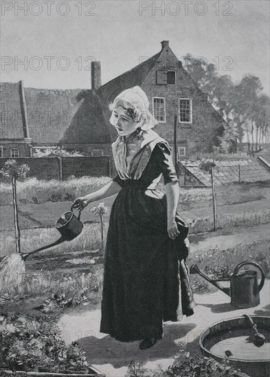 Girl watering in the home garden