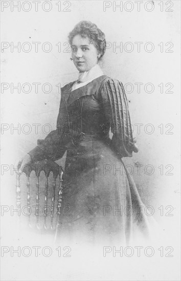 Woman in dark Sunday dress