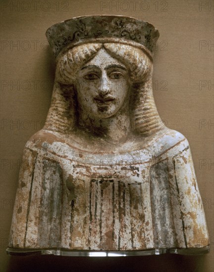 Bust of a woman or goddess wearing a polos and polychrome clothes