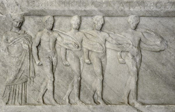 Base of a dedication, detail. Military Pyrrhic dance and the circular dance.