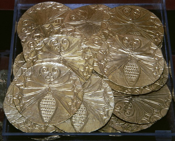 Mycenaean gold roundels with repousse decoration depicting a bee.