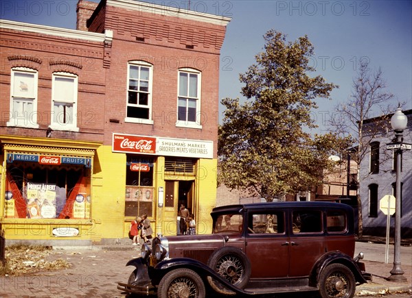 hulman's Market at the southeast corner of N Street and Union Street S.W., Washington, D.C., with a 1931 Chevrolet car parked in front  ca 1941-1942 .