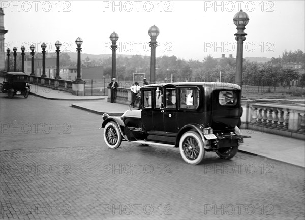 Car crossing a bridge in Washington D.C. circa 1919.