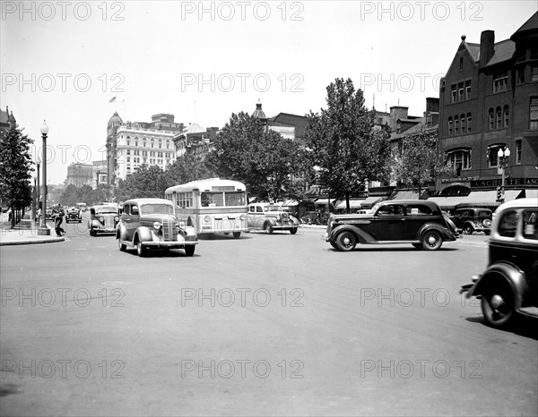 Bus and cars in Washington D.C. traffic street scene circa July 1936.